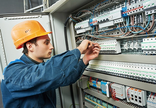 An industrial facility receiving customized electrical solutions from skilled contractors. Dependable commercial electrical contractor service.