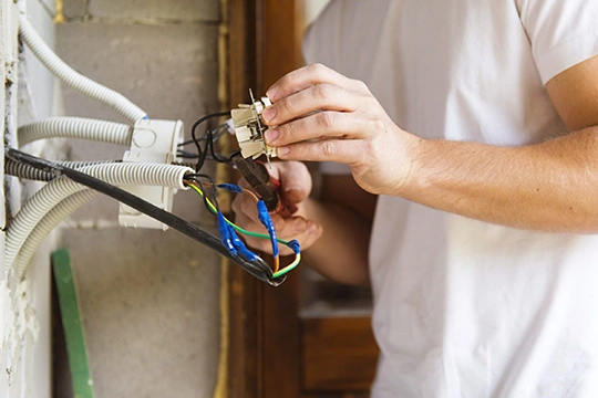 Licensed electrician upgrading a home's electrical panel for safety and efficiency. Trusted residential electrical services provider.
